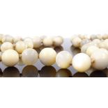 A string of polished mother-of-pearl beads necklace, length 870mm