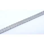 A 9ct white gold diamond tennis double line bracelet, total diamond content approx 1ct, length