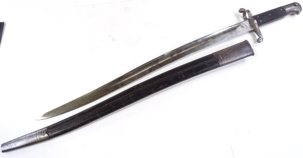 A late 19th century sword bayonet, overall length 71cm, original metal-mounted leather scabbard - Image 3 of 3