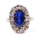 An unmarked gold large sapphire and diamond cluster ring, sapphire measures 11.5mm x 6.74mm x 4.2mm,