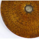 A Chinese gilded and lacquered compass, with bands of text, diameter 17cm