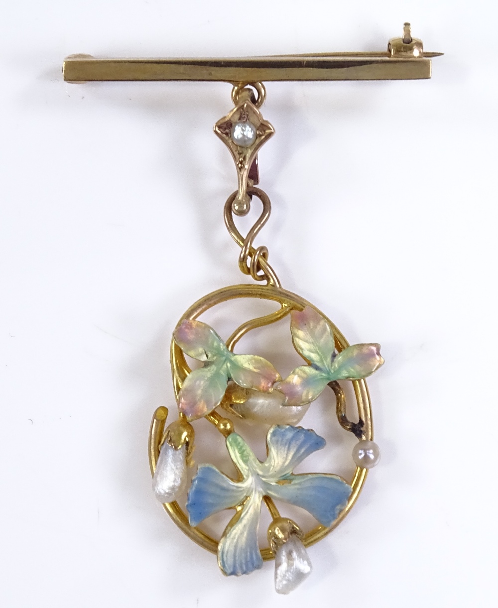 An Edwardian 9ct gold pearl and coloured enamel stylised pendant brooch, with openwork iris body and