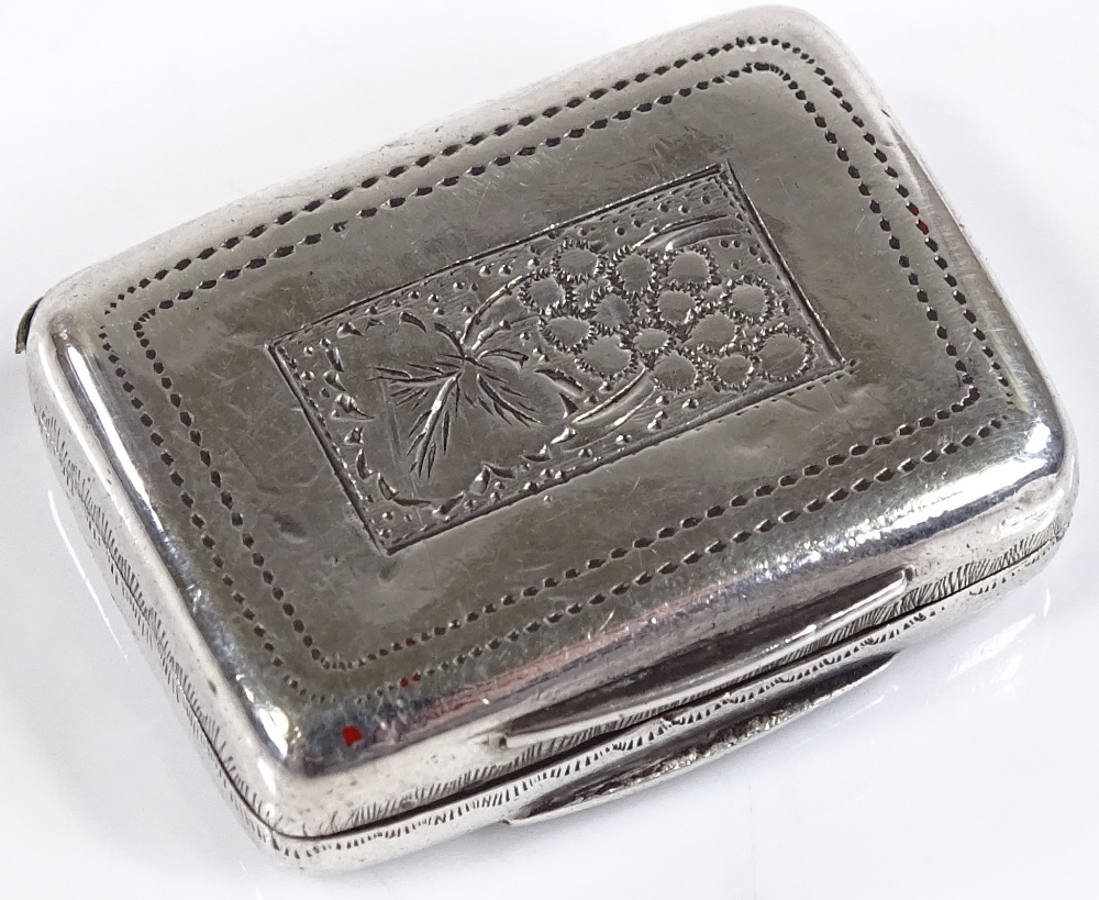 A miniature rectangular silver vinaigrette, with circular pierced grille and floral engraved - Image 2 of 3