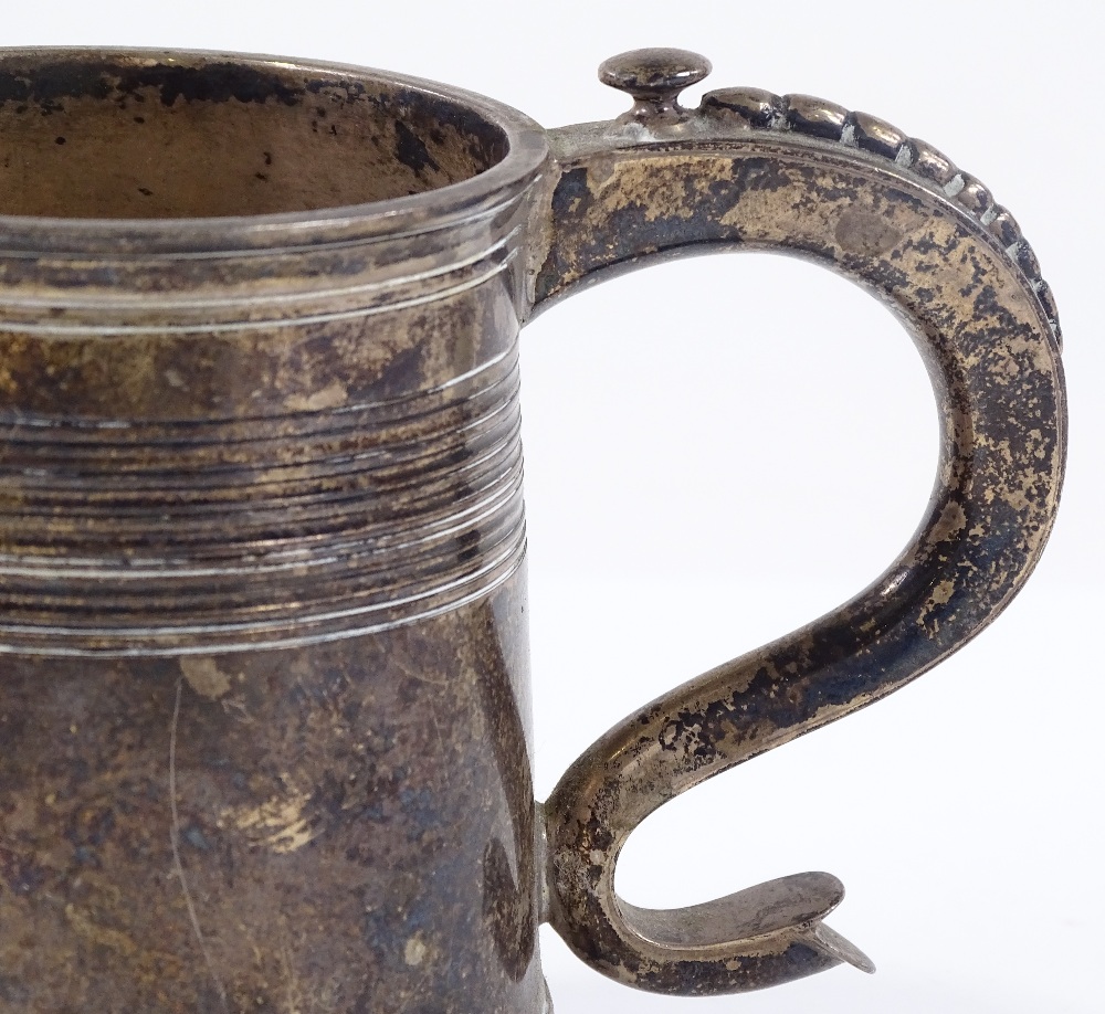 A tapered silver half-pint mug, with reeded collar and foot, by C S Harris & Sons Ltd, hallmarks