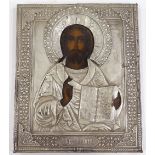 A Russian embossed white metal-mounted icon, overall dimensions 26cm x 22cm