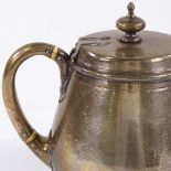A Victorian tapered circular silver teapot, with engine turned body and ivory insulators, by John
