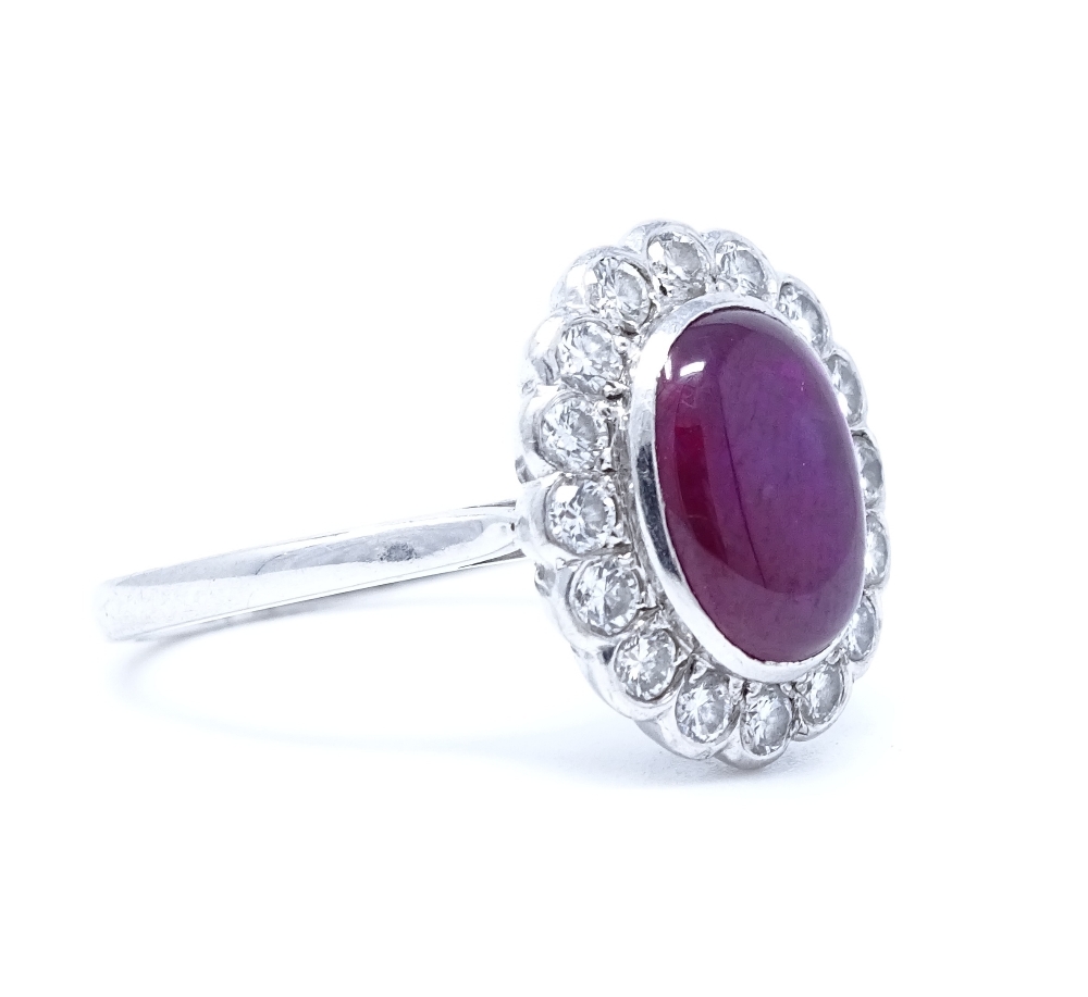 An 18ct white gold cabochon ruby and diamond cluster ring, ruby dimensions 9.6mm x 7.36mm x 3. - Image 2 of 4
