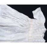 A large collection of Victorian and later lacemaker's bobbins, and embroidered christening gowns,