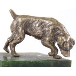 An Edwardian cast-silver model of a dog, hallmarks London 1906, maker's marks WH, on green onyx