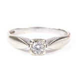 A 9ct white gold solitaire diamond ring, diamond approx 0.12ct, setting height 4.5mm, size N, 2.4g