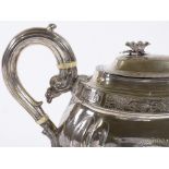 A George III oval silver teapot, with applied flower finial, bright-cut floral frieze and foliate