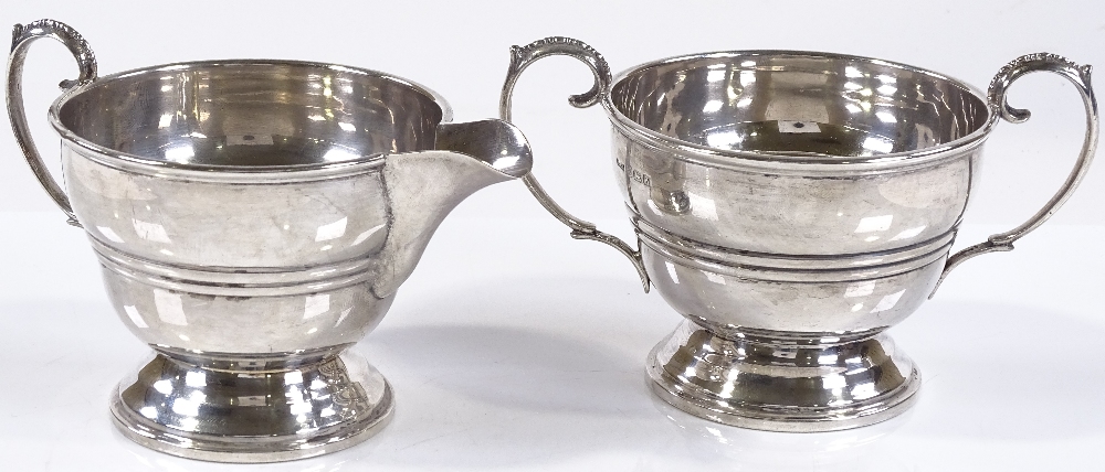 A matching silver cream jug and sugar bowl, of circular form with banded body, by Ernest W - Image 2 of 3