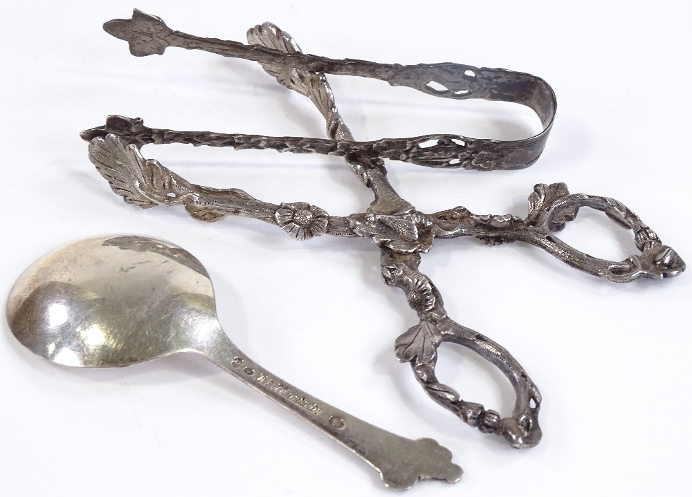 A pair of unmarked silver sugar nips, together with a pair of Swedish silver tongs, and a Danish - Image 3 of 3