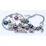 Various silver charms and bracelets, including Pandora