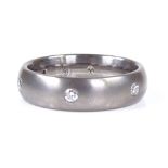 A brushed titanium diamond wedding band ring, total diamond content approx 0.25ct, maker's marks WJ,