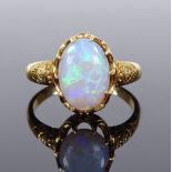 An 18ct gold cabochon opal dress ring, setting height 12.6mm, size L, 3.5g