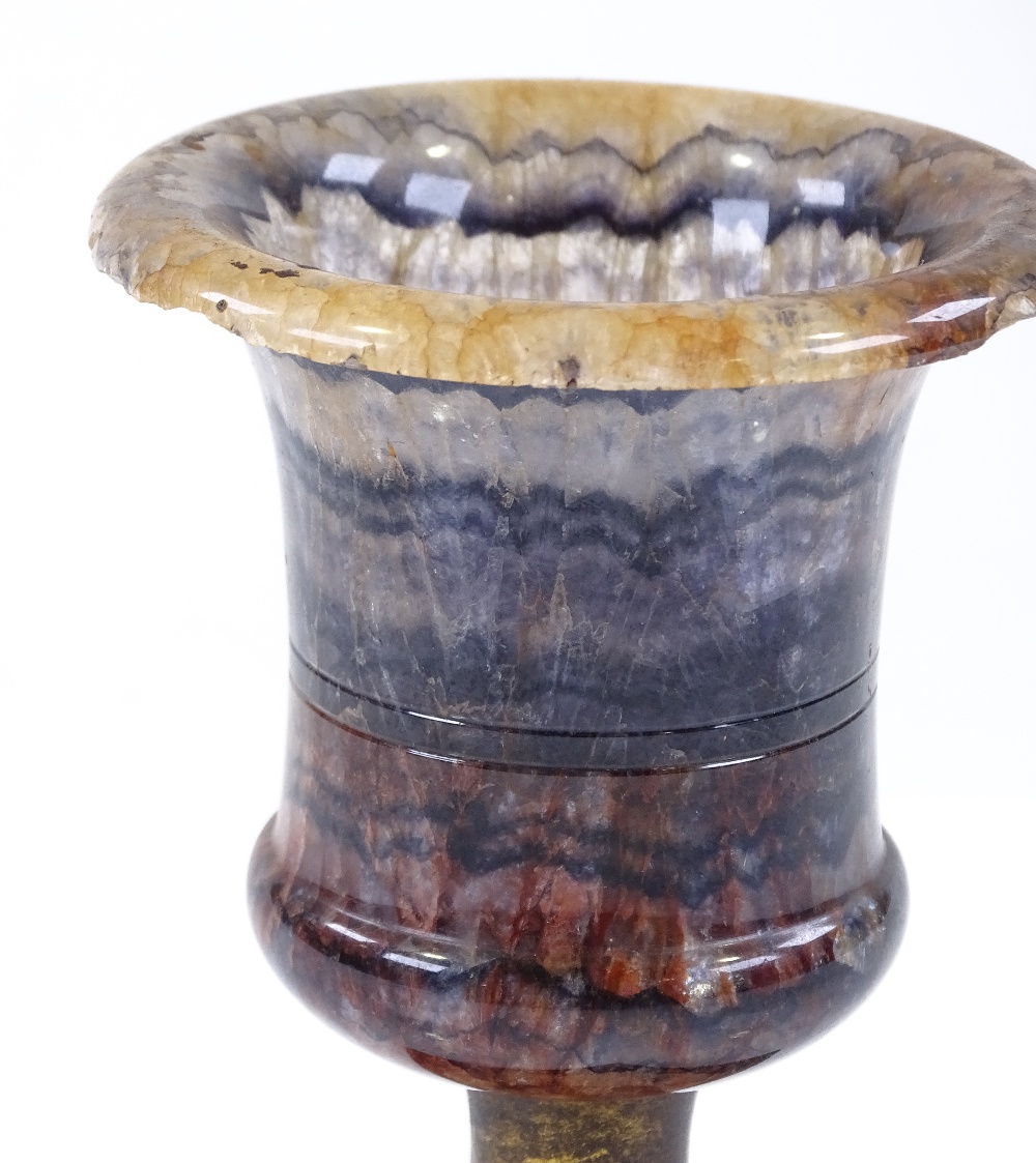 A 19th century Blue John campana form urn, with brass column and slate base, overall height 12.