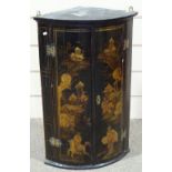 An 18th century chinoiserie gilded and lacquered bow-front hanging corner cupboard
