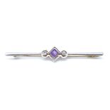 An 18ct 3-stone amethyst and diamond bar brooch, with central openwork settings, length 64mm, 5.6g