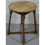 A circular oak occasional table, 22" across