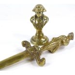 A brass paper knife with figure handle, and a small brass bust (2)
