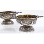 A pair of Victorian Scottish silver table salts, with elk-head handles and relief embossed game bird