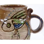 An Oxshott Pottery jug by Denise Wren, circa 1920s, with sgraffito design of a fish, height 17cm,