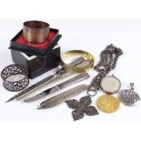 A silver paper knife, napkin rings, pendants etc