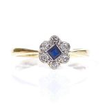 An 18ct gold sapphire and diamond cluster flowerhead ring, setting height 7.6mm, size N, 2.5g