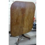 A George IV rectangular mahogany tilt-top breakfast table, on centre column and quadruple base