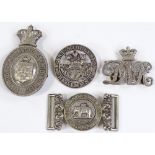 A group of military badges and buckles, including a Duke of Wellington's West Riding Regiment cap