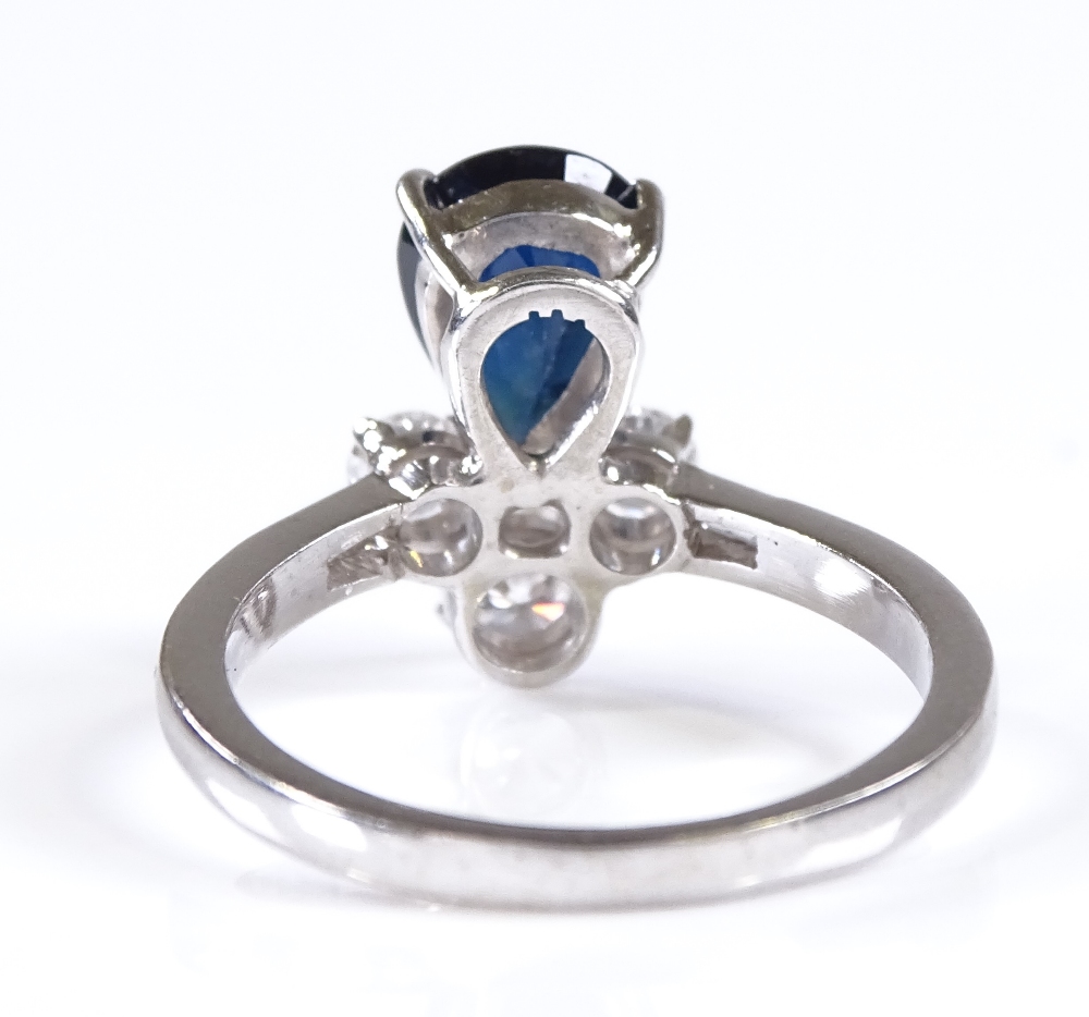 An 18ct white gold sapphire and diamond dress ring, with baguette-cut diamond shoulders, pear-cut - Image 2 of 4