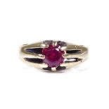 An unmarked gold solitaire ruby gypsy ring, setting height 8.3mm, size R, 3.4g