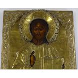 An Antique Russian or Greek embossed brass-framed icon, 44cm x 37cm