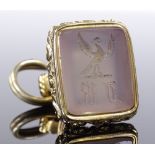 A Victorian gilt-metal fob seal, with intaglio carved hardstone and griffin emblem, height excluding