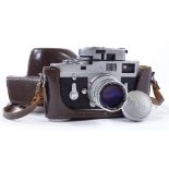 A Leica M2 camera, circa 1966, serial no. 1143648, leather-cased