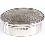 An oval silver pillbox, with engine turned lid, by Levi & Salaman, hallmarks Birmingham 1910, length