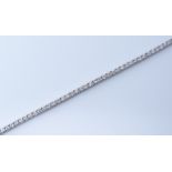 An 18ct white gold diamond tennis line bracelet, total diamond content approx 2.5cts set with 71