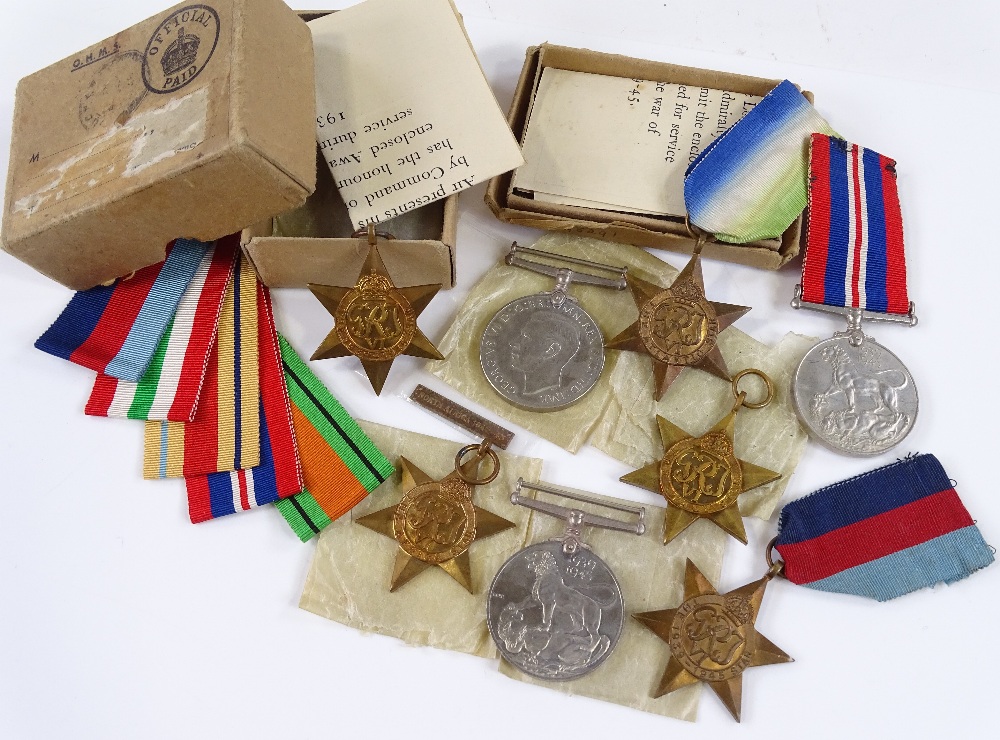 5 Second World War medals with Africa clasp, ribbons and papers, and 3 boxed Second War Period