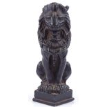 A 19th century bronze patinated cast-iron sculpture of a lion, height 12cm