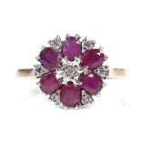A 9ct gold ruby and diamond cluster flowerhead ring, setting height 12.2mm, size P, 2.7g