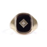 A 9ct gold onyx and diamond set signet ring, setting height 14.6mm, size S, 3.3g