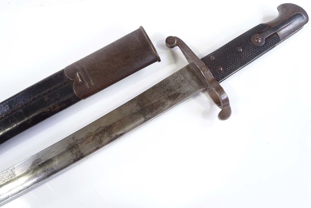 A late 19th century sword bayonet, overall length 71cm, original metal-mounted leather scabbard - Image 2 of 3