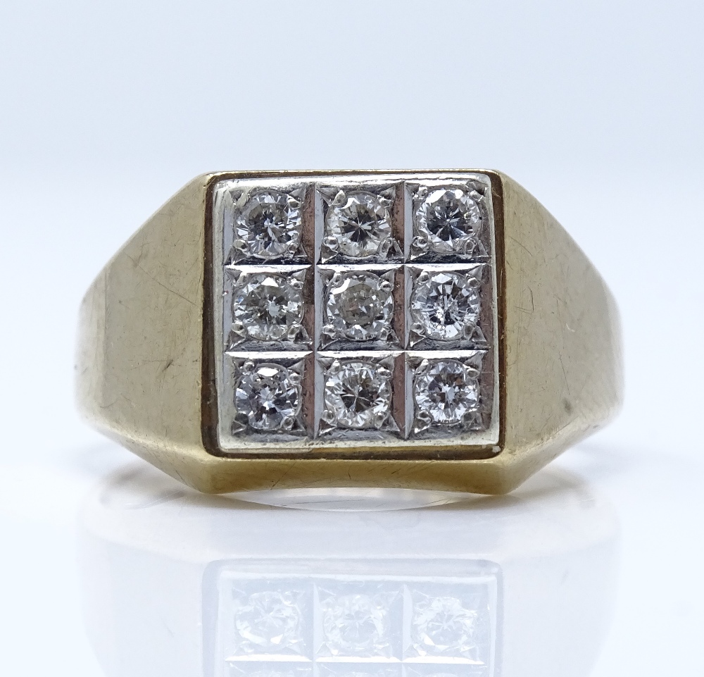 A 9ct gold 9-stone diamond cluster signet ring, setting height 11.5mm, size R, 4.1g