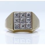 A 9ct gold 9-stone diamond cluster signet ring, setting height 11.5mm, size R, 4.1g