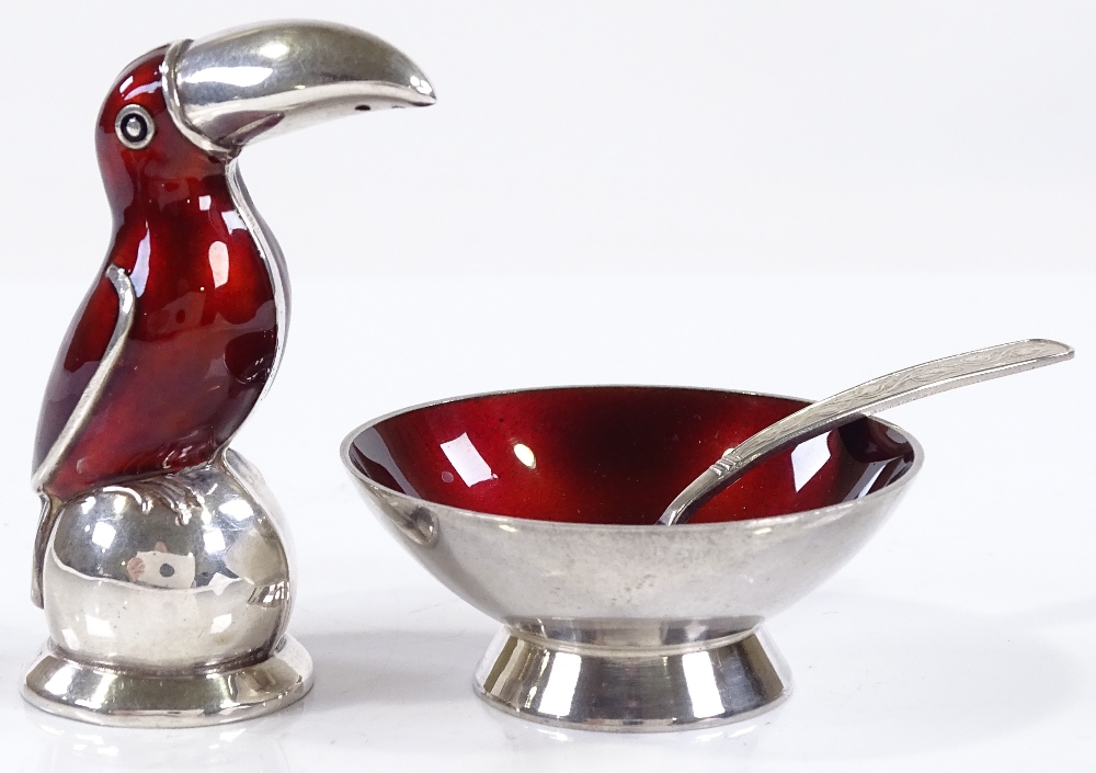 A Danish sterling silver and red enamel cruet set, comprising toucan-shaped pepperette and salt bowl