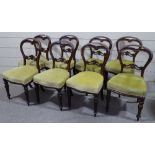 A set of 8 Victorian mahogany carved balloon-back dining chairs on turned legs