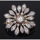 An unmarked gold diamond set flowerhead spray brooch, diameter 30.7mm, 8g