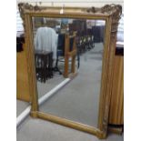 A large 19th century gilt-gesso framed wall mirror, with floral mounts, 5' x 3'8"