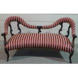 A Victorian rosewood parlour sofa with carved acanthus scroll supports, shaped seat on cabriole legs